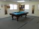 Well-equipped game room with billiard table at 1310 Moray Ct, Leesburg, FL 34788