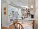 Kitchen with breakfast nook and white appliances at 1310 Moray Ct, Leesburg, FL 34788