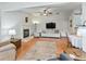 Spacious living room with fireplace and hardwood floors at 1310 Moray Ct, Leesburg, FL 34788
