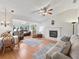 Spacious living room with hardwood floors and fireplace at 1310 Moray Ct, Leesburg, FL 34788