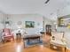 Living room boasts hardwood floors, and elegant furnishings at 1310 Moray Ct, Leesburg, FL 34788
