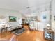 Living room with hardwood floors, comfy seating, and decorative accents at 1310 Moray Ct, Leesburg, FL 34788