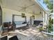 Relaxing patio with a swing, hot tub, and ceiling fan at 1310 Moray Ct, Leesburg, FL 34788