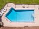 Community pool with surrounding lounge chairs at 1310 Moray Ct, Leesburg, FL 34788