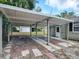 Covered carport with parking for two cars at 1323 Liberty Ave, Mount Dora, FL 32757