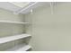 Walk-in pantry with ample shelving for storage at 13536 Se Sunset Harbor Rd, Weirsdale, FL 32195