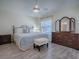 Spacious main bedroom with wooden furniture, stylish decor, and ample natural light at 1500 Alexa Pl, The Villages, FL 32162