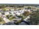 Aerial view of the community and a nearby golf course at 1557 Hillcrest Dr, The Villages, FL 32159