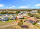 An aerial view of a house with a backyard and surrounding neighborhood at 16304 Spring View Ct, Clermont, FL 34711