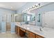 Elegant bathroom with double sinks and a large shower at 1654 Grandeflora Ave, Clermont, FL 34711