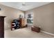 Bedroom with antique dresser and stained glass at 1807 Dalton Dr, The Villages, FL 32162