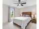 Bedroom with ceiling fan, window, and neutral color palette at 2469 Morven Park Way, The Villages, FL 32162