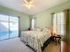 Bright bedroom with pool view and king-size bed at 25516 Laurel Valley Rd, Leesburg, FL 34748