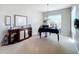 Elegant dining room featuring a grand piano at 25516 Laurel Valley Rd, Leesburg, FL 34748