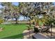 Firepit area overlooking a pond and lush landscape at 2717 Dunham Dr, The Villages, FL 32163