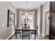 Bright dining room with a wooden table, chairs, and chandelier at 2717 Dunham Dr, The Villages, FL 32163