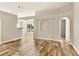 Inviting living room with wood-look flooring and arched doorways at 31806 Parkdale Dr, Leesburg, FL 34748