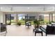 Screened porch with seating, ceiling fans, and a view of the backyard at 3766 Causey Ct, The Villages, FL 32163