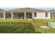 Spacious screened-in back porch overlooking a grassy backyard at 3766 Causey Ct, The Villages, FL 32163