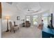 Bright bedroom with multiple windows, ceiling fan, and comfortable seating at 3766 Causey Ct, The Villages, FL 32163