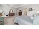 Cozy bedroom with soft carpeting, a ceiling fan, and ample natural light at 3766 Causey Ct, The Villages, FL 32163