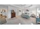 Inviting bedroom with plush carpeting, a ceiling fan, and access to an ensuite bathroom at 3766 Causey Ct, The Villages, FL 32163