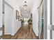 Inviting entryway with wood-look tile flooring and open sightlines to other rooms at 3766 Causey Ct, The Villages, FL 32163