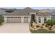 Charming one-story home with a three-car garage, landscaped yard, and paved driveway at 3766 Causey Ct, The Villages, FL 32163