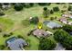 Aerial view showing home's location in a golf course community at 39539 Harbor Hills Blvd, Lady Lake, FL 32159
