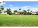 Large backyard with lush grass and a view of the home at 39539 Harbor Hills Blvd, Lady Lake, FL 32159