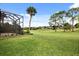 Relaxing backyard with a screened patio overlooking a scenic golf course at 39539 Harbor Hills Blvd, Lady Lake, FL 32159