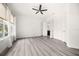Spacious bedroom with wood-look flooring and ceiling fan at 39539 Harbor Hills Blvd, Lady Lake, FL 32159