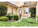 Landscaped front entry with a walkway and a decorative gate at 39539 Harbor Hills Blvd, Lady Lake, FL 32159