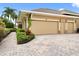 Two-car garage with paver driveway and landscaping at 39539 Harbor Hills Blvd, Lady Lake, FL 32159