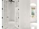 Open concept entryway with french doors and white walls and flooring at 39539 Harbor Hills Blvd, Lady Lake, FL 32159
