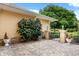 Backyard patio with paver stones, lush greenery, and a tranquil atmosphere at 39539 Harbor Hills Blvd, Lady Lake, FL 32159