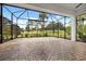 Spacious screened patio with brick pavers and golf course view at 39539 Harbor Hills Blvd, Lady Lake, FL 32159