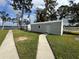 A detached garage with a paved driveway, situated near the waterfront at 4060 Lake Marianna Dr, Winter Haven, FL 33881