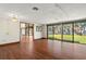 Hardwood floor dining room with access to living room and water views at 5415 Banana Point Dr, Okahumpka, FL 34762