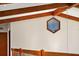 Interior detail of a hallway with unique hexagonal stained-glass window at 5415 Banana Point Dr, Okahumpka, FL 34762