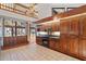 Spacious kitchen with dark wood cabinets, granite countertops, and a view at 5415 Banana Point Dr, Okahumpka, FL 34762