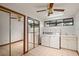 Laundry room with washer, dryer, and built-in cabinets at 5415 Banana Point Dr, Okahumpka, FL 34762