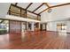 Open living area with hardwood floors, high ceilings, and a loft at 5415 Banana Point Dr, Okahumpka, FL 34762