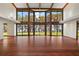 Living room with wall-to-wall windows overlooking the water at 5415 Banana Point Dr, Okahumpka, FL 34762