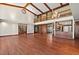 High-ceilinged living room with hardwood floors and a view of the kitchen at 5415 Banana Point Dr, Okahumpka, FL 34762