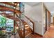 Stunning wooden spiral staircase with natural light at 5415 Banana Point Dr, Okahumpka, FL 34762