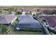 Home with a screened-in pool and solar panels at 747 Bradford Loop, The Villages, FL 32163