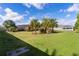 Expansive backyard with tropical landscaping and pool at 747 Bradford Loop, The Villages, FL 32163