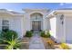 Welcoming front entry with a paved walkway and attractive landscaping at 747 Bradford Loop, The Villages, FL 32163
