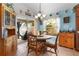 Charming kitchen nook with wood table and chairs, and access to backyard at 747 Bradford Loop, The Villages, FL 32163
